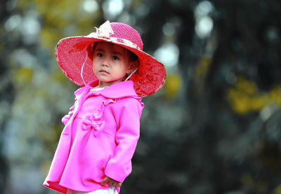 Close-up of cute girl in pink hat