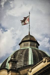 Low angle view of built structure against cloudy sky