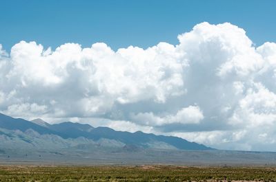 Scenic view of landscape and mountains against sky