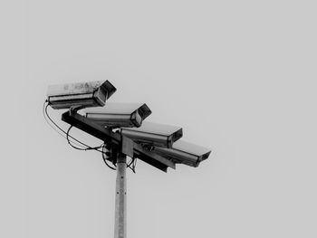 Surveillance cameras against sky