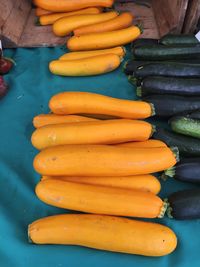 Close-up of yellow and green squash for sale in market