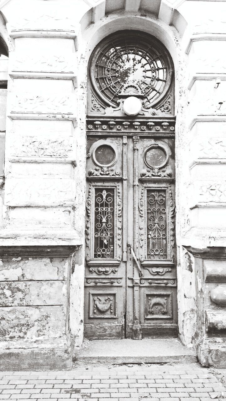 door, architecture, entrance, built structure, building exterior, closed, arch, religion, wood - material, place of worship, church, ornate, gate, spirituality, day, doorway, old, wooden, no people