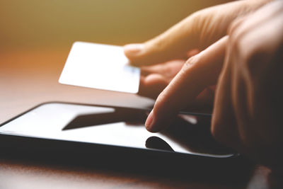 Close-up of man using mobile phone