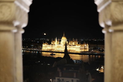 Illuminated buildings in city at night