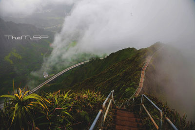 Scenic view of mountains against sky during foggy weather