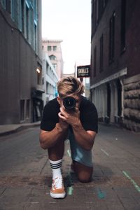 Full length of woman photographing