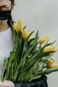 Girl with tulips in her hands.