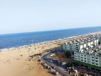 High angle view of road by sea against clear sky