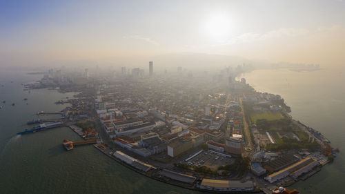 High angle view of city buildings during sunset