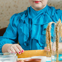 Women's hands roll out dough. gomentash biscuits with poppy seeds traditional for the jewish holiday