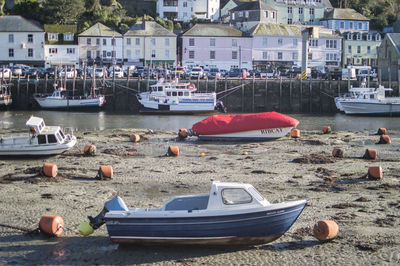 Boats moored at harbor