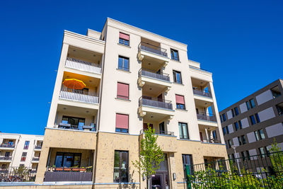 Modern beige multi-family house seen in berlin, germany