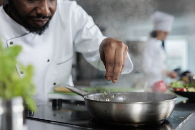 Chef preparing food in kitchen