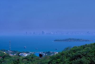 High angle view of bay against blue sky