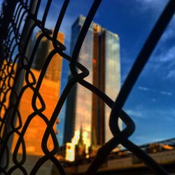 Silhouette of fence against sunset