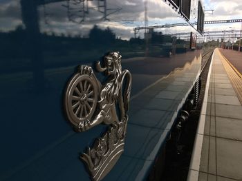 Railroad station in city against sky