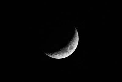 Low angle view of moon against sky at night