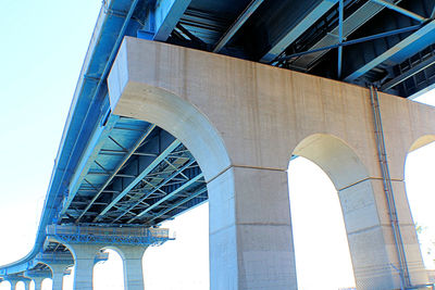 Low angle view of bridge in city