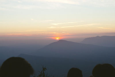 Scenic view of silhouette mountains against sky during sunset