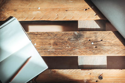 High angle view of paper and pencil on table