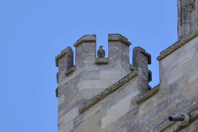 Low angle view of castle against clear blue sky