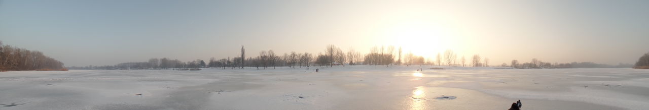 Scenic view of snow covered landscape against sky