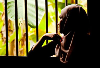 Side view of young woman