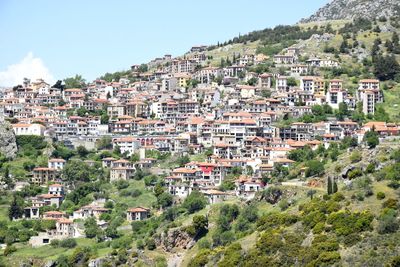 Buildings in town against clear sky
