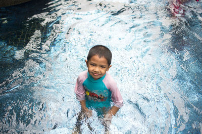 Portrait of boy in swimming pool