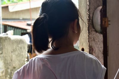 Rear view of woman standing outdoors