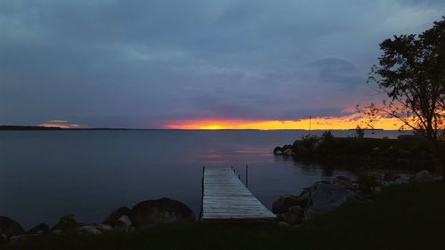 Scenic view of dramatic sky over sea during sunset