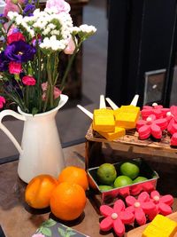Close-up of various flowers in vase on table