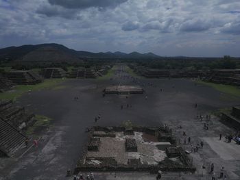 High angle view of old town against cloudy sky