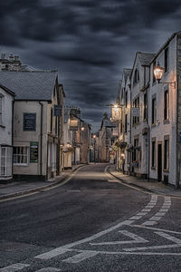 Road by city against sky