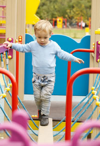 Cute boy playing in playground