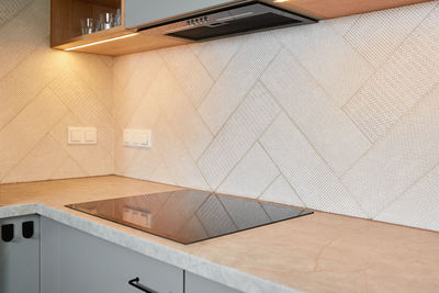 Kitchen interior with induction hob and hood