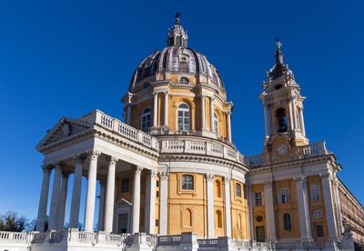 Low angle view of church against blue sky