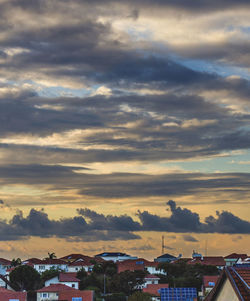 Townscape against sky during sunset