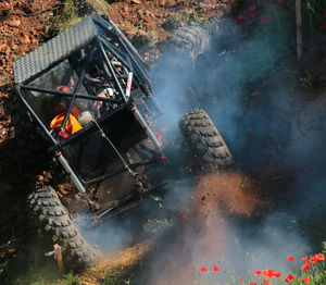 High angle view of vehicle stuck on field