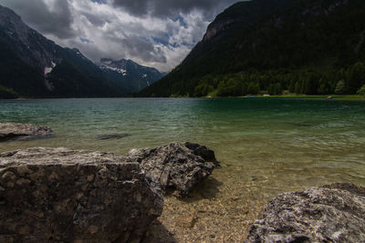 Scenic view of lake and mountains against sky