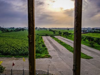 Scenic view of field against sky during sunset