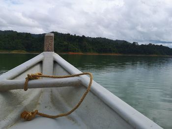 Boat on lake against sky