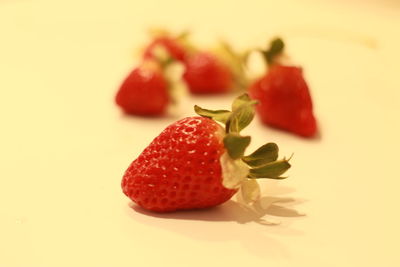 Close-up of strawberry over white background