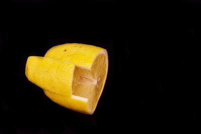 Close-up of lemon slice over black background