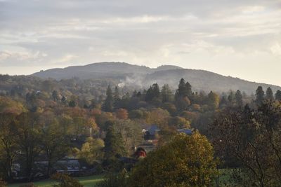 Scenic view of landscape against sky during autumn