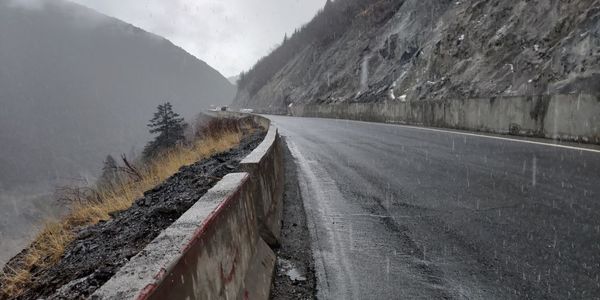 Road by mountains during winter