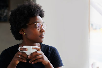 Young woman drinking coffee cup