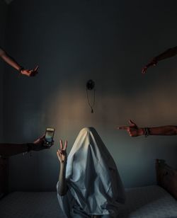 Digital composite image of woman with arms raised