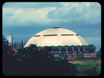 Built structure against cloudy sky