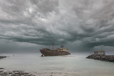 Boat in sea against sky